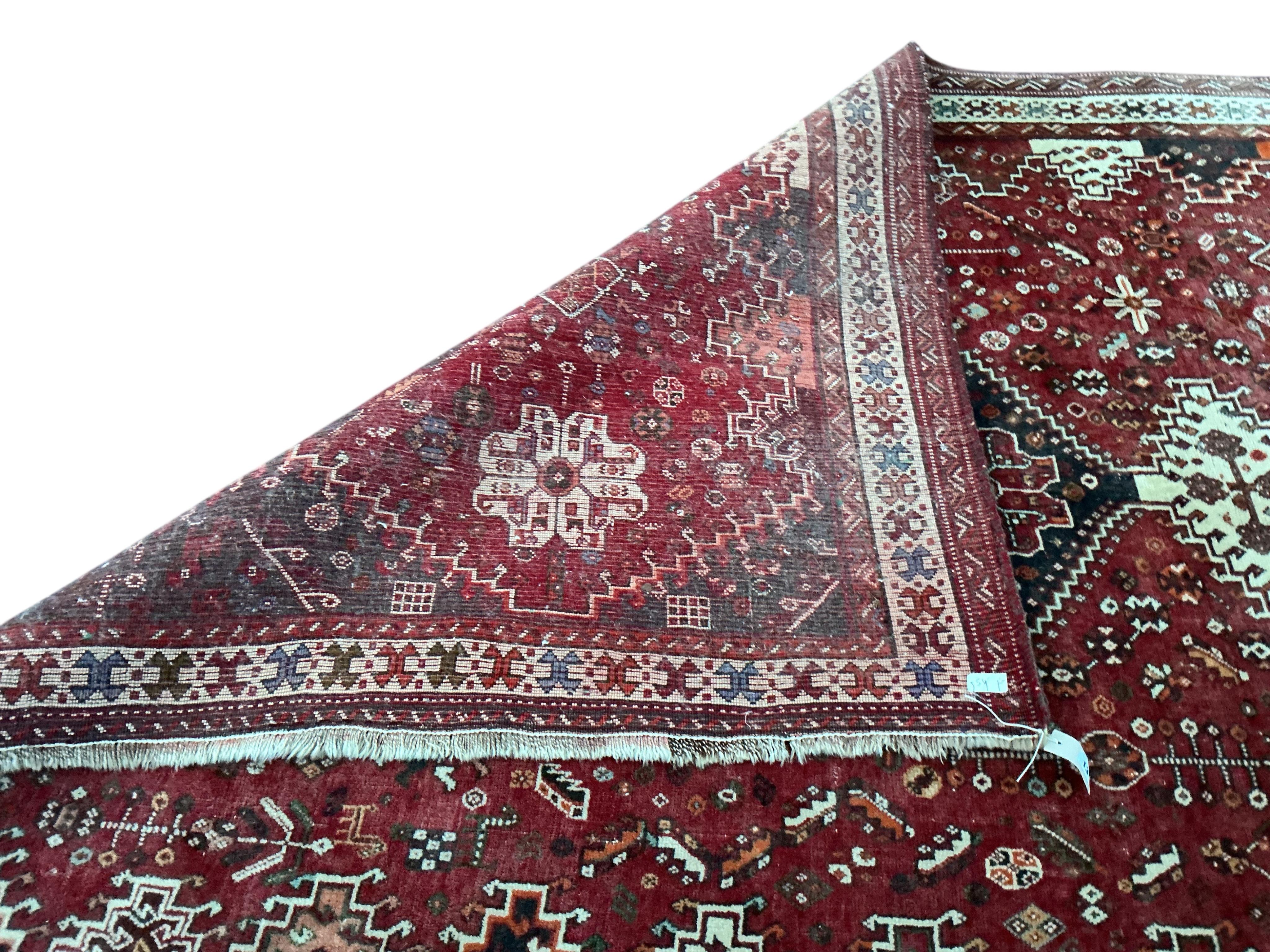 A Hamadan red ground carpet, 255 x 180cm
